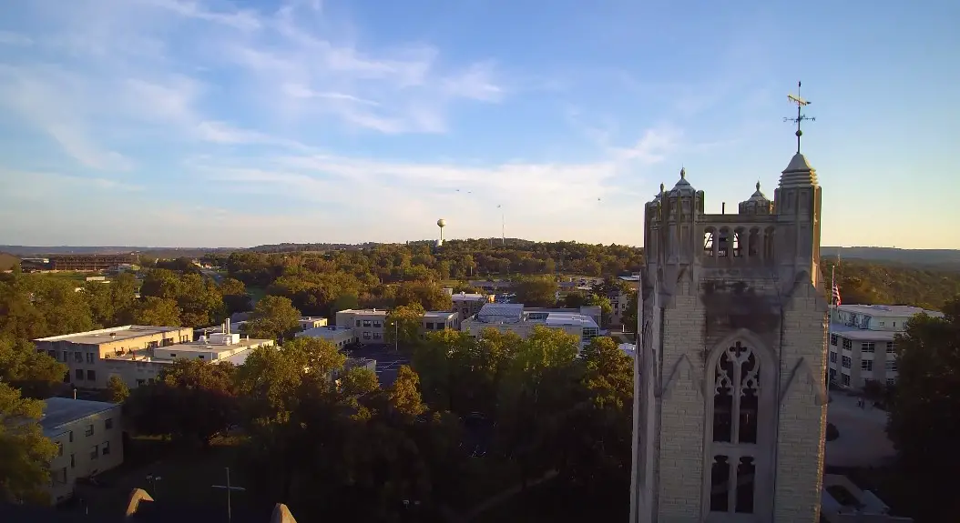 College of the Ozarks tower unfolds beneath a vibrant sky