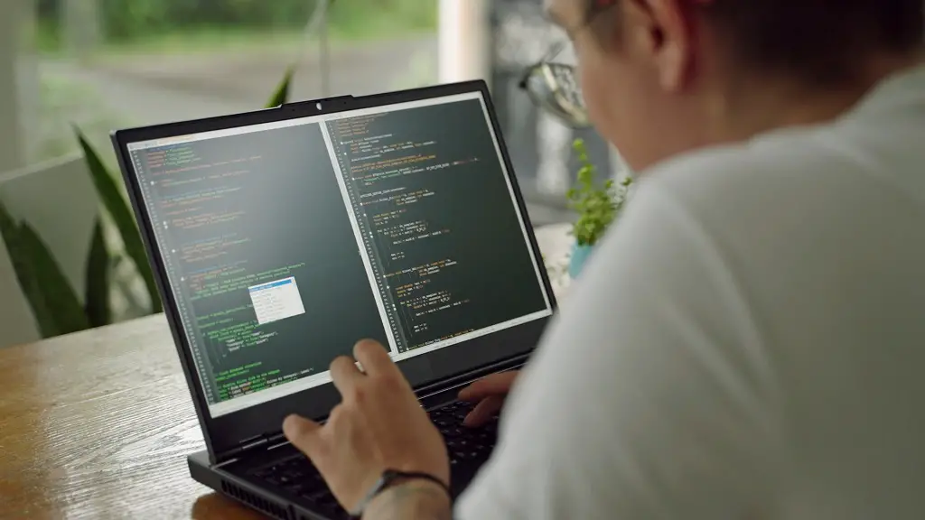 Person working on a laptop with code displayed on the screen, representing tech careers that rely on skills and certifications instead of formal degrees